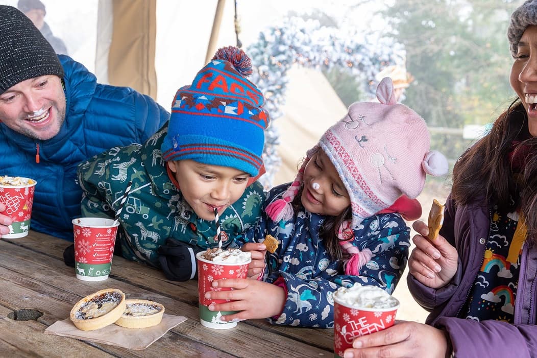 A family enjoying hot chocolates together