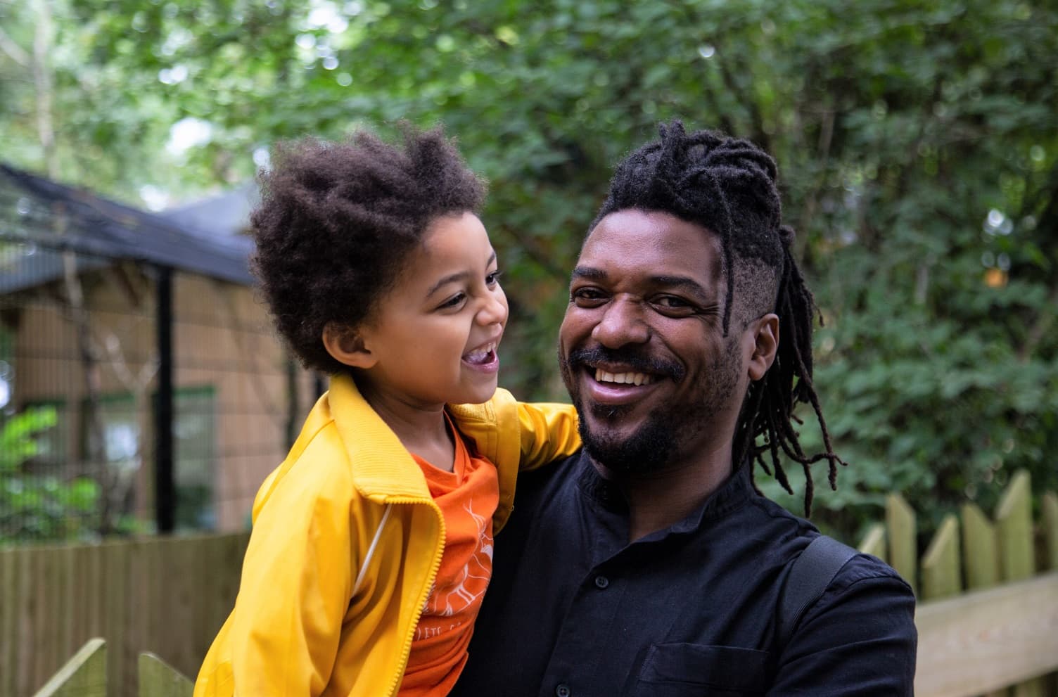 A dad holding his young son
