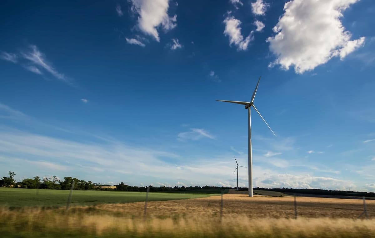 A wind turbine standing in a field
